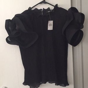 New with the tag on black elegant blouse